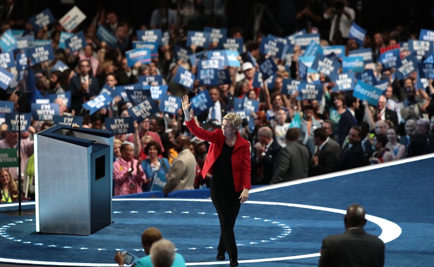 Sen. Elizabeth Warren leaves the stage after giving her remarks. "We are not going to be Donald Trump's hate-filled America," she said.
