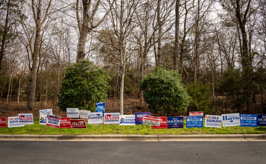 Signs in Charlotte, N.C. near an early voting site for the primary elections. Democrats say they think they can win the presidential race in November because of voter concerns about abortion rights.