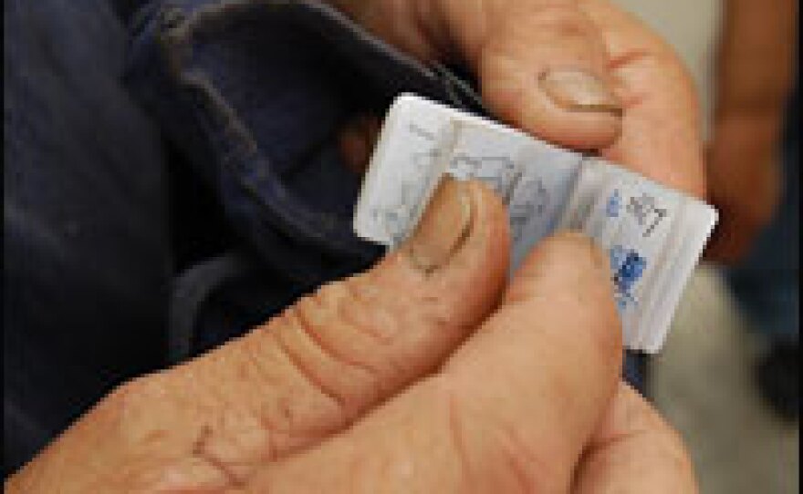 Luo Anzhe flips through his tiny telephone book.