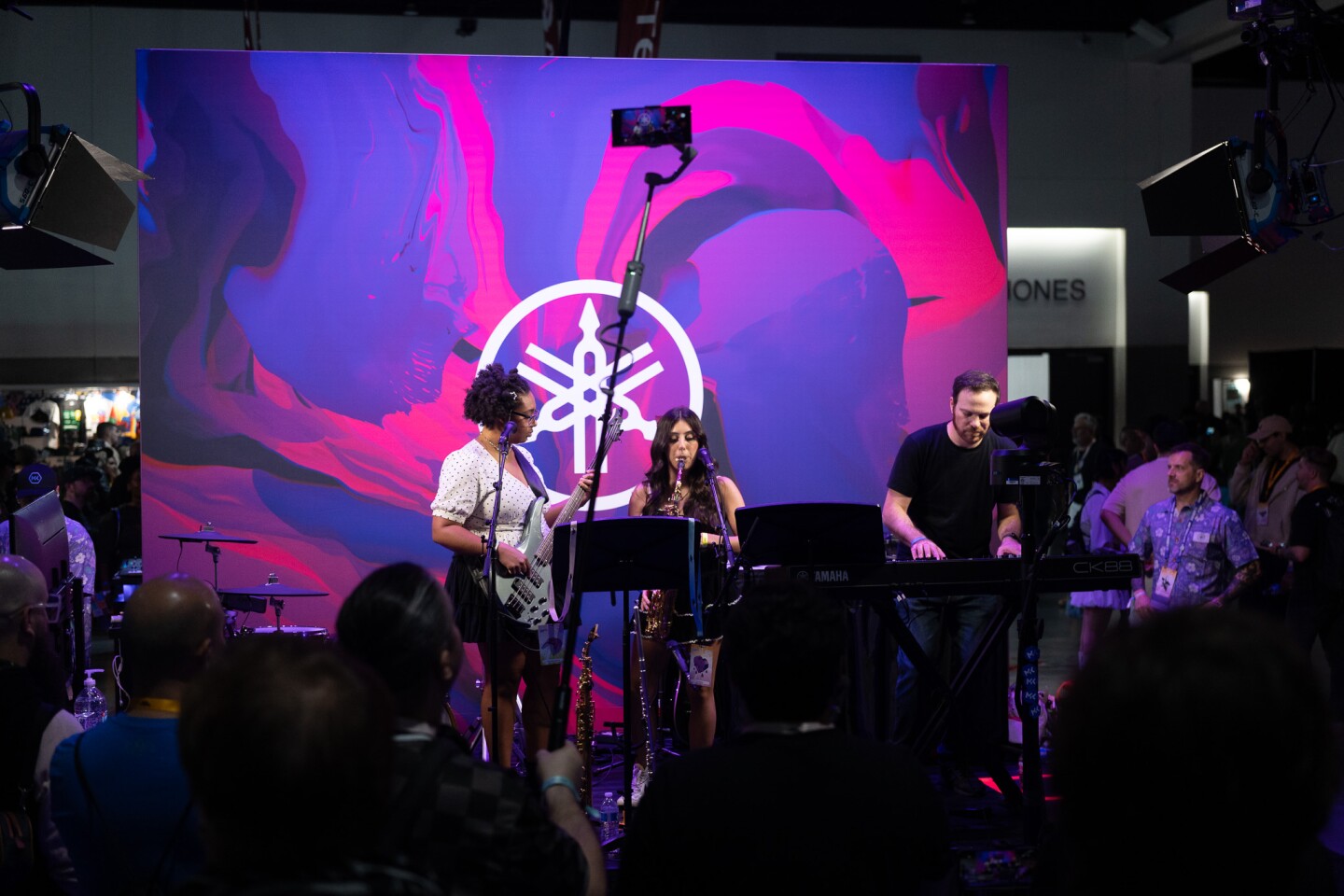 A trio of musicians perform popular themes from anime at TwitchCon in San Diego on Oct. 17, 2025.