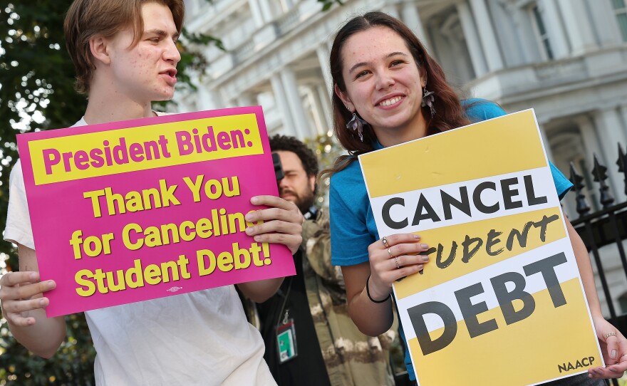 Student loan borrowers stage a rally in front of The White House on Aug. 25 to celebrate President Biden cancelling student debt. The plan has sparked heated debate, including about its economic fairness.