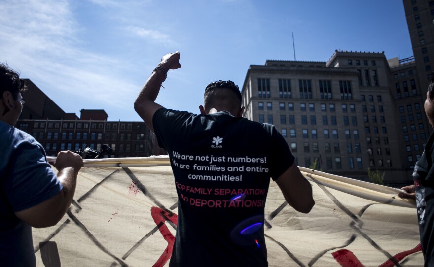 Organizers from Mijente, Georgia Latino Alliance for Human Rights, Ruckus Society and other activist organizations stage a protest and march outside Quicken Loans Arena in Cleveland during the Republican National Convention in July 2016.