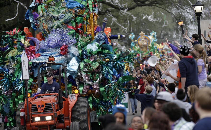 Monday: Floats pass down Napoleon Ave. during the Krewe of Mid-City parade.