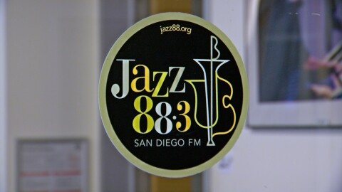 The logo of KSDS Jazz 88.3 is shown on a glass station door on August 5, 2025.