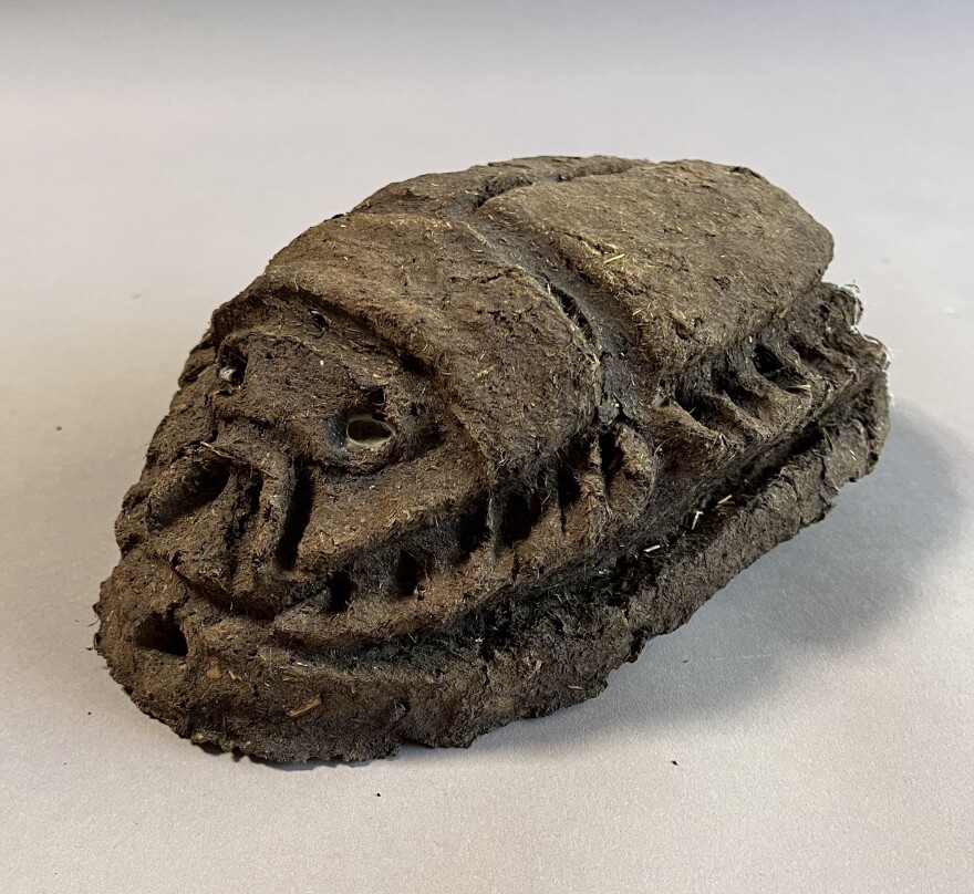 A fertilizer brick in the shape of a dung beetle. Artist Richard Turner had the bricks custom made and placed them around the Biosolids Center as part of the landscaping.