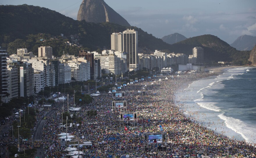 Pilgrims and residents gather on Copacabana beach before the arrival of Pope Francis for World Youth Day in Rio de Janeiro in July.