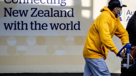 Passengers arrive at Auckland's International Airport, in Auckland, New Zealand, on Wednesday.