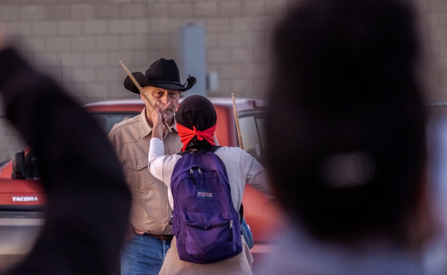 A man on his way to the Lakeside Rodeo was confronted by a protester after he began to yell is opposition at marchers who were upset over the stabbing of a teen black girl by a white 16-year-old boy in an apparent hate crime, Lakeside April 23, 2022.