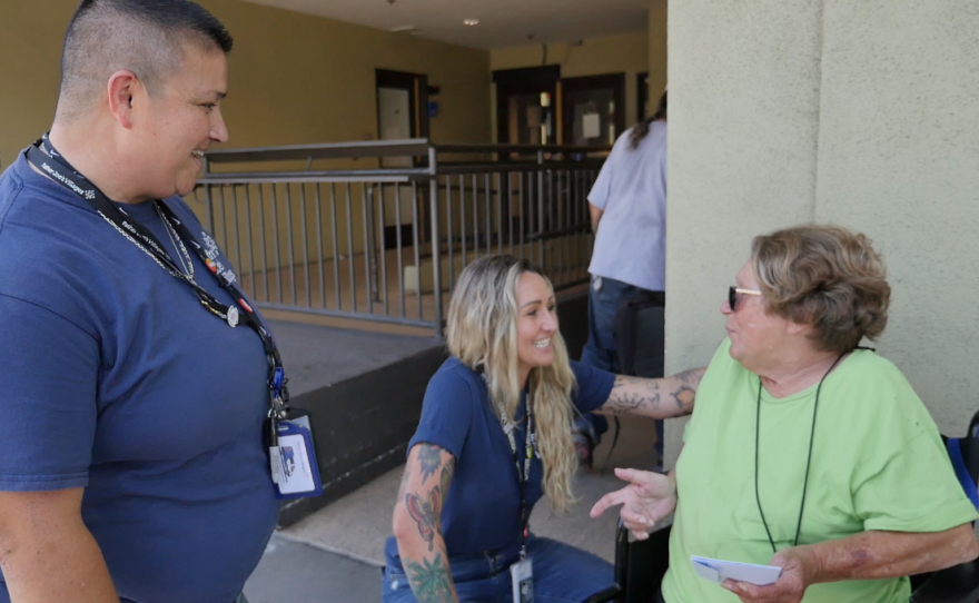 Father Joe's Villages Street Health Team outreach worker Michelle LeFever (left) and supervisor Jennifer Wilkens (center) talk with formerly unsheltered resident Ruthie Lavinia Wilson (right) in downtown San Diego on Aug. 1, 2023.