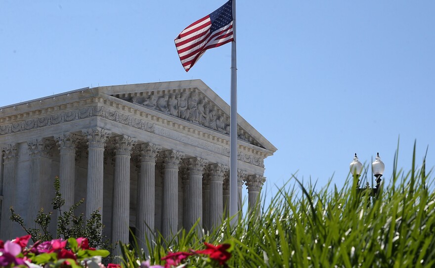 An American flag flies over the Supreme Court in June.