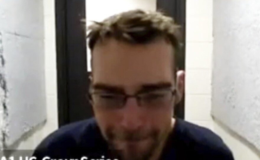 James Crumbley appears remotely at his arraignment in Oakland County, Mich., on Saturday.