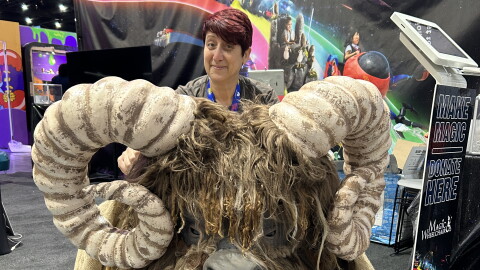 KPBS arts reporter Beth Accomando visits the Magic Wheelchair booth at Comic-Con and admires a Bantha costume created for children who use wheelchairs on July 22, 2026.