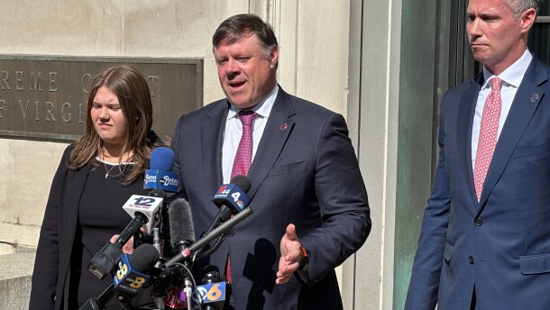 State Senate Minority Leader Ryan McDougle, center, speaks with the media following a hearing on new congressional maps before the state Supreme Court in Richmond, Va. on April 27.