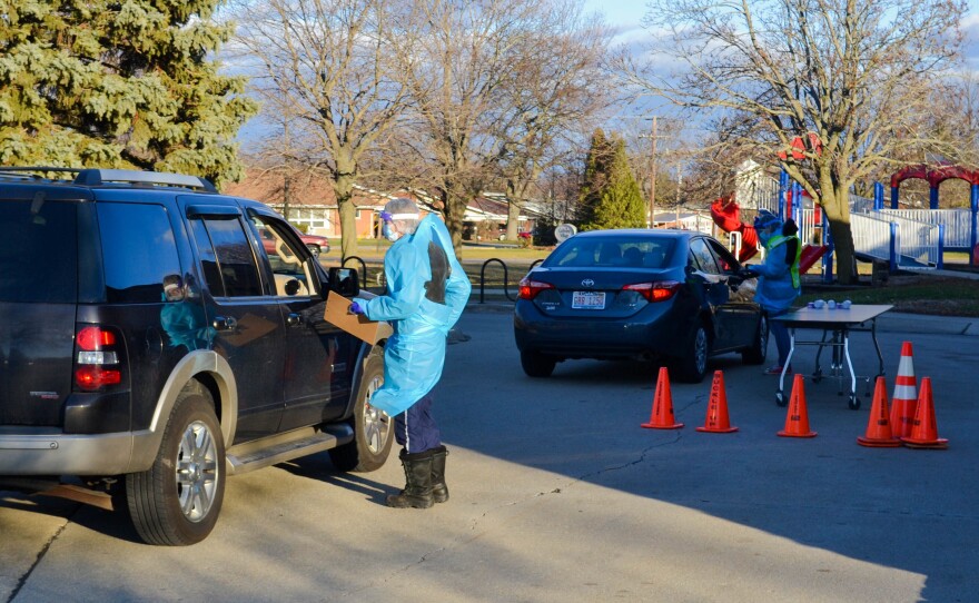 Before conducting the nasal swab test for COVID-19 at the Rantoul, Ill., clinic, researchers go out to greet each visitor and ask for basic identification and health information.