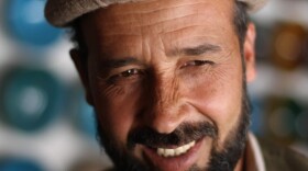 Abdul Wahkeel at his pottery stall in the Afghan village of Istalif. He was among the first potters to return after the fall of the Taliban.
