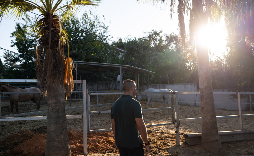 Lior, 34, an Israeli reservist soldier who commanded a sniper unit during wars in Gaza and Lebanon, poses for a portrait at a farm in Udim, Israel where he plans to launch a horse therapy program for veterans with post traumatic stress disorder.