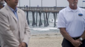 A surfer rides a wave in the ocean off of Imperial Beach while Senator Steve Padilla (D-San Diego) along with researchers from Scripps Institution of Oceanography, University of California San Diego announced $3 million for the development of a program to predict the amount of pathogens in the Tijuana River Estuary. Padilla says the new system will be able to tell beachgoers if the water near the US/Mexico border is safe to swim in, Imperial Beach, August 25, 2025.<br/><br/><br/>