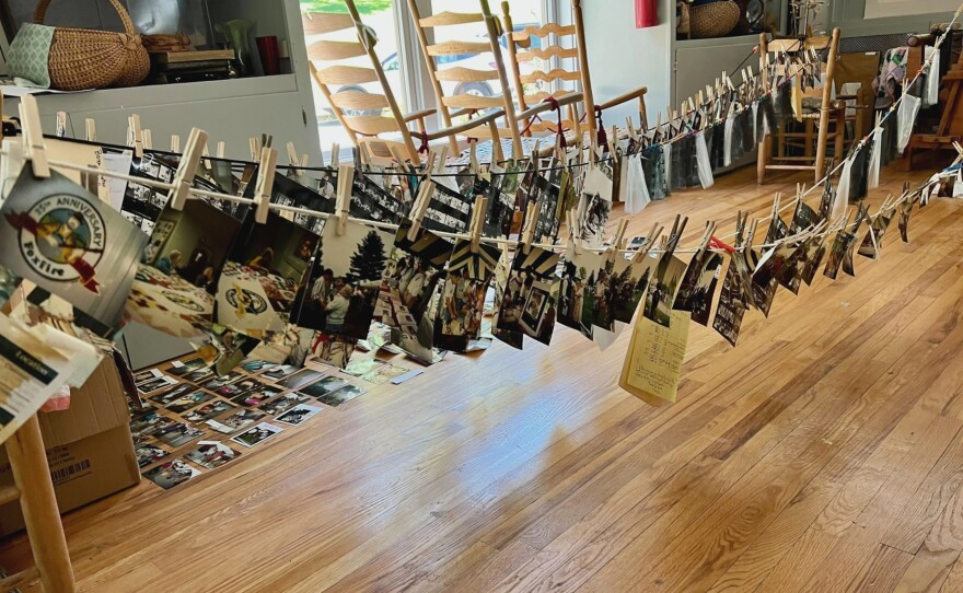 Photographs soaked by the flooding at Hindman Settlement School dry on clotheslines.