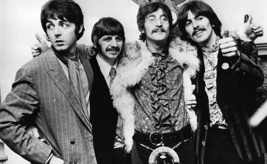 The Beatles celebrate the completion of their new album, Sgt. Pepper's Lonely Hearts Club Band, on May 19, 1967. During the 1960s, Martin was their closest collaborator—producing almost all of The Beatles' music, playing piano with them, writing their orchestral arrangements and figuring out how to turn John Lennon and Paul McCartney's wilder ideas into records.