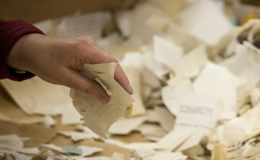 A worker in the former headquarters of the Stasi sorts hundreds of thousands of torn or shredded Stasi documents in January. Workers are sifting through thousands of bags, containing between 50,000 and 80,000 fragments each.