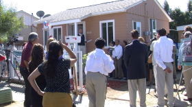 San Diego city leaders and community members celebrate the completion of 25 home rehabilitations in City Heights, September 24, 2013. 