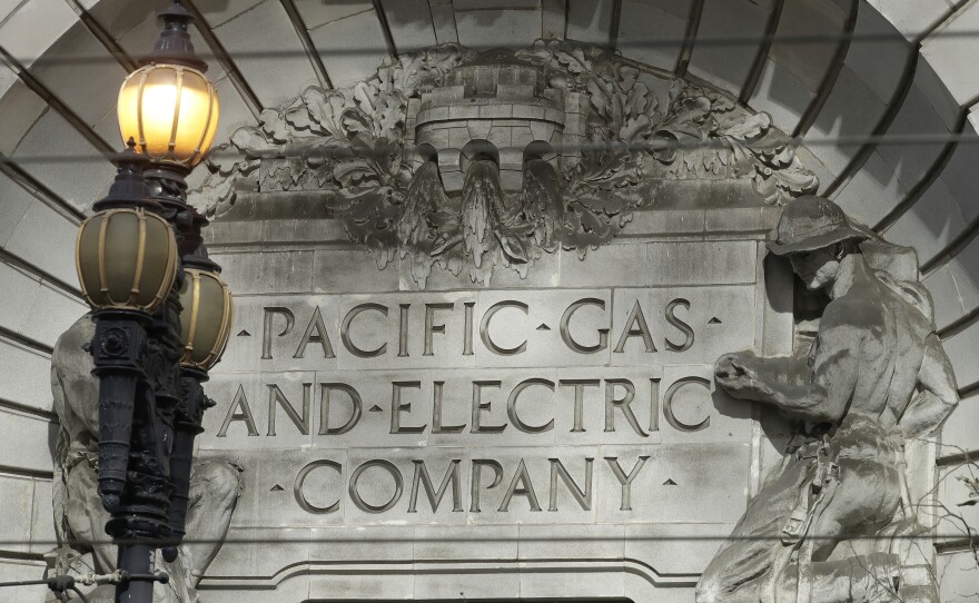 A Pacific Gas & Electric sign is shown outside of a PG&E building in San Francisco, Oct. 10, 2019.