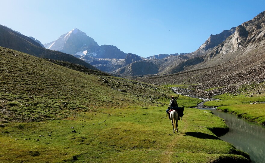 A Panjshiri guide rides through one of the valleys leading to Mir Samir, one of Afghanistan's most challenging peaks, near which the Afghan women and girls set up base camp for their climbing expedition.