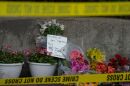 Flowers are left for victims of the 4th of July mass shooting in downtown Highland Park, Illinois.
