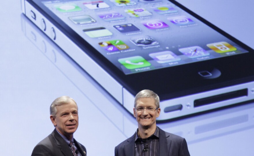 Lowell McAdam (left), Verizon's president, and Tim Cook, chief operating officer of Apple, announce that Verizon Wireless will carry Apple's iPhone 4. Verizon's iPhone has a new feature -- a mobile hot spot.