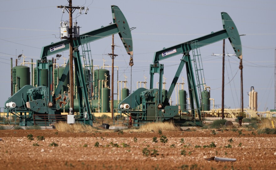 In this July 29, 2020 file photo, a view of a pump jack operating in an oil field in Midland, Texas.