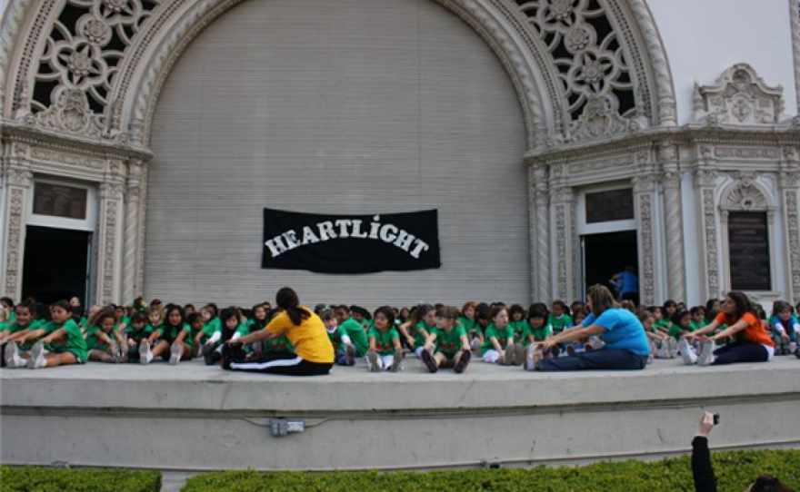 Children stretch as they participate in a Heartlight USA program.