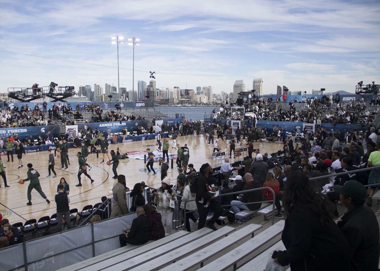 MSU and Gonzaga warm up aboard the USS Abraham Lincoln in port at Naval Air Station North Island with downtown San Diego in the background on Nov. 11, 2022.