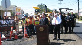 Councilman Todd Gloria talks to reporters about street repairs in San Diego. Mayor Jerry Sanders also spoke at the news conference.
