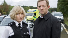 The investigation of a multi-vehicle road accident unravels the shocking secrets of the complete strangers involved, revealing government cover-ups, smuggling, embezzlement, and murder. A remarkable cast portrays the stories of 10 people who share a single defining moment. Pictured: Kate Ashfield as Ann Stallwood and Douglas Henshall as DI John Tolin. 