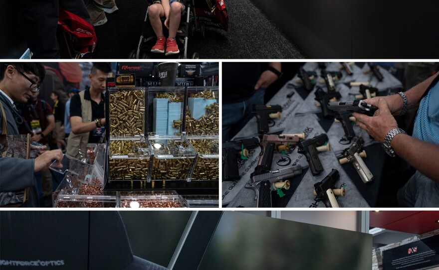 People attend to look at the displayed gusn and free bullets and casings at the NRA Annual Meetings & Exhibits.