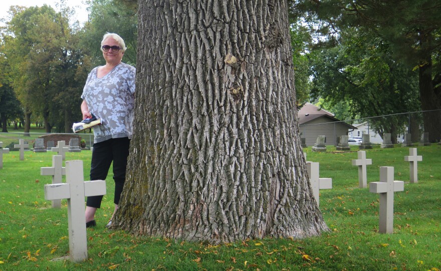 In the small cemetery behind what was once the Minnesota State Public School for Dependent and Neglected Children, graves were marked with a stone and just a number. Anne Peterson, director of a museum there, worked to add crosses with the names of each of the 198 children buried there.
