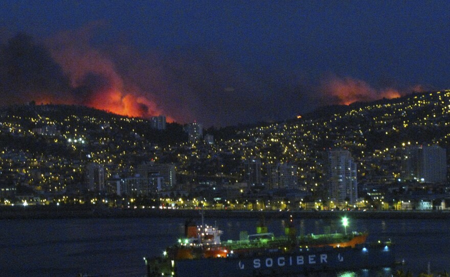 Smoke from the forest fire is seen in Valparaiso on Friday.