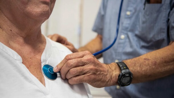 A doctor listens to a patient's heartbeat at the Mountain Valley Health Center in Bieber on July 24, 2019.