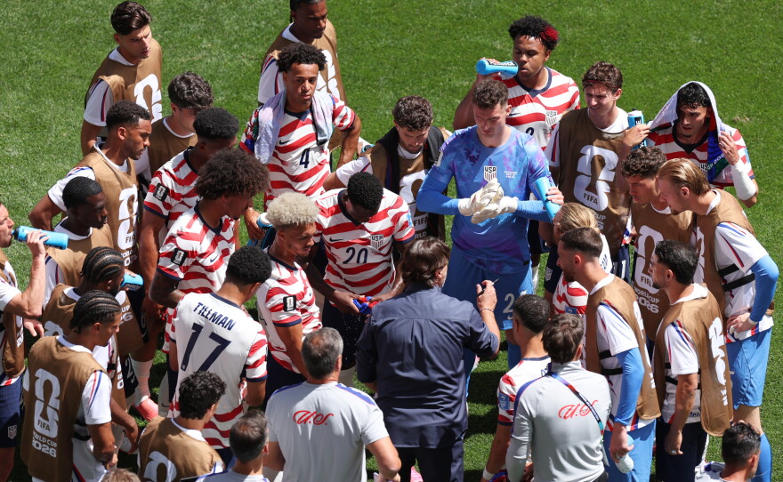 United States head coach Mauricio Pochettino, center, speaks to his players during the World Cup group match against Australia in Seattle, June 19, 2026. "Why not us," has been a mantra pushed by the coach to encourage the squad to believe they can go deep in the tournament.