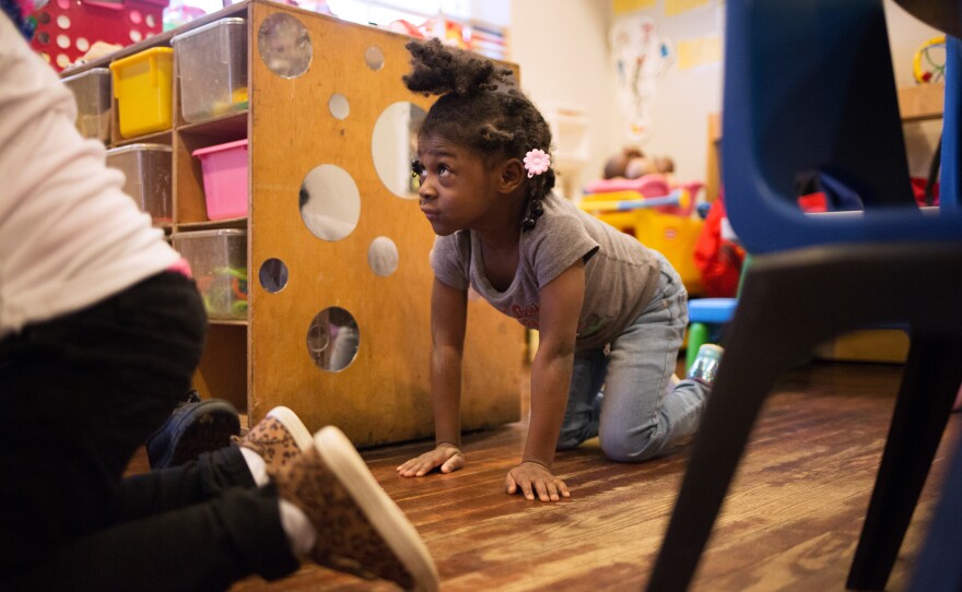 Justice Buress, 4, demonstrates how she drops to the floor when she hears her teacher call out "Dora the Explorer" during monthly drills at Little Explorers Learning Center.