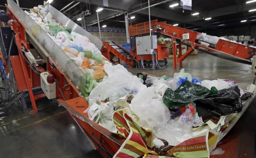 California Gov. Jerry Brown has signed the nation's first state-wide ban on single-use plastic bags. Here, mixed plastic items are seen at a recycling plant in Vernon, Calif., earlier this year.