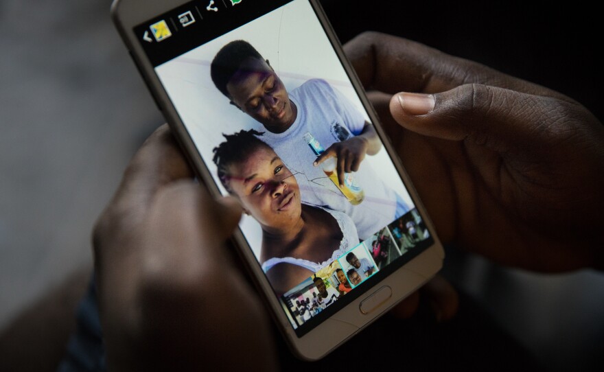 Bobson Timothee keeps a photo on his phone of himself with his best friend, Stephanie Forestal, who died during the storm.