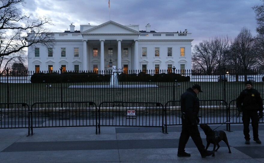 Secret Service officers patrol in front of the White House on Jan. 20.