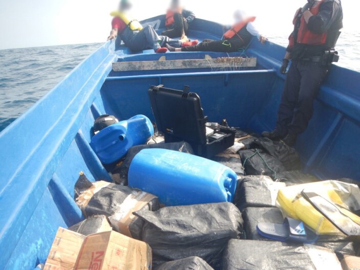 Members of the Coast Guard Cutter Active boarding team inspect a suspected smuggling vessel containing more than 2,000 pounds of cocaine in international waters of the Eastern Pacific Ocean in May 2020.