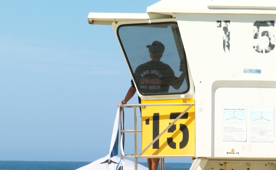 A lifeguard on duty watches over the crowds in Mission Beach, CA on September 5, 2022.