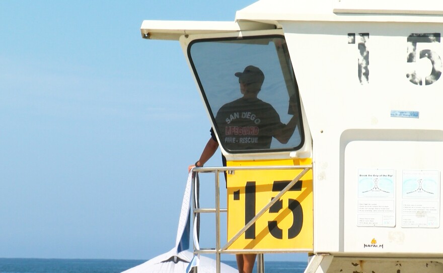 A lifeguard on duty watches over the crowds in Mission Beach, CA on September 5, 2022. 