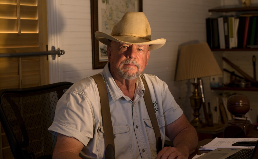 Will Harris, a fourth-generation cattleman and the owner of White Oak Pastures, sits in his office in downtown Bluffton, Ga. In earlier times, Harris sold fertilizers and pesticides. Today, he practices regenerative land management, restoring cycles of nature to land degraded by industrialized processes.
