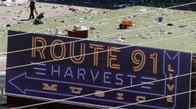 Investigators work the scene after a mass shooting at a music festival near the Mandalay Bay resort and casino on the Las Vegas Strip on Sunday in Las Vegas,  Monday, Oct. 2, 2017. 