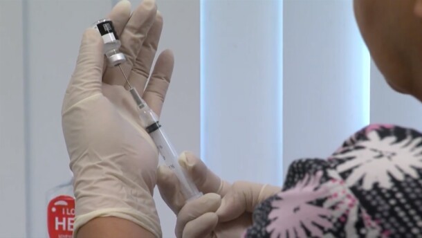 A San Diego health care worker prepares a flu vaccine in this undated photo.