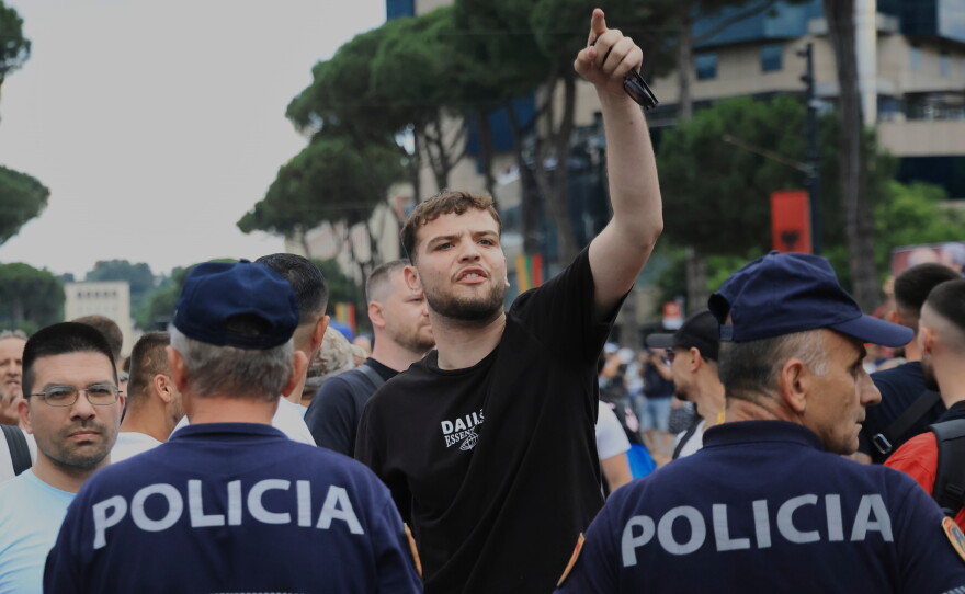 Police officers block a street during a demonstration in Tirana, Albania, Wednesday, June 3, 2026, opposing a luxury coastal development project linked to Jared Kushner and Ivanka Trump over concerns about environmental impacts and transparency.
